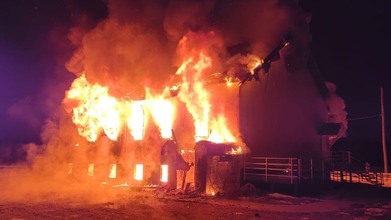 A church is totally engulfed in flames. A church is totally engulfed in flames.