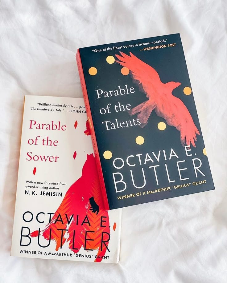 This may contain: two books sitting on top of a bed next to each other in front of white sheets