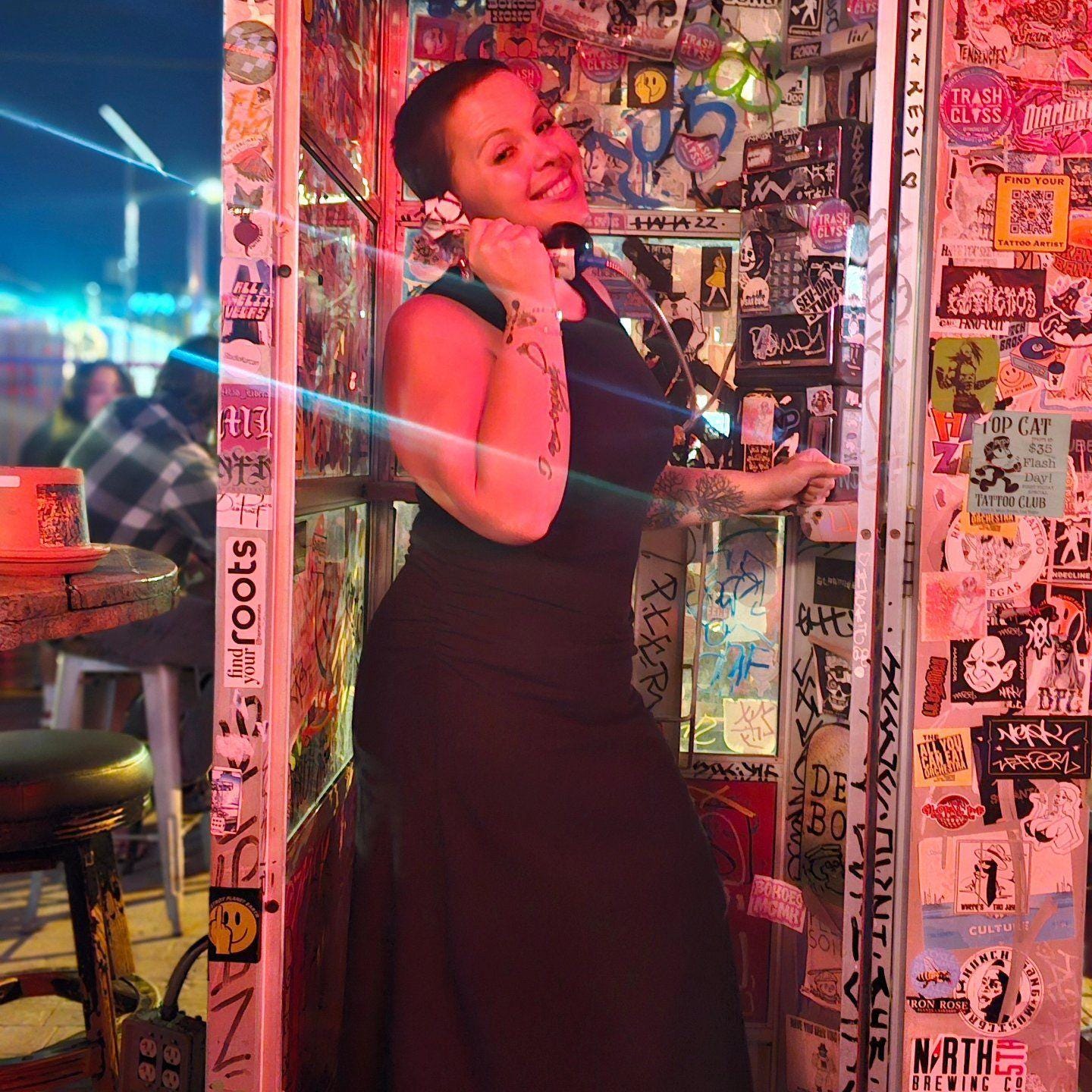 May be an image of 3 people, phone and text