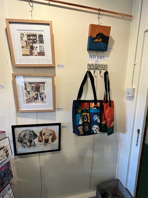 Photo of Dog portraits hung on the wall of the artist Jo Scotts Studio