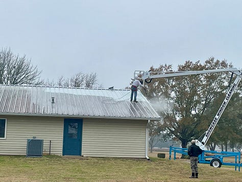 Photos of the halls roof while pressure washing and me enjoying my ride on the lift.
