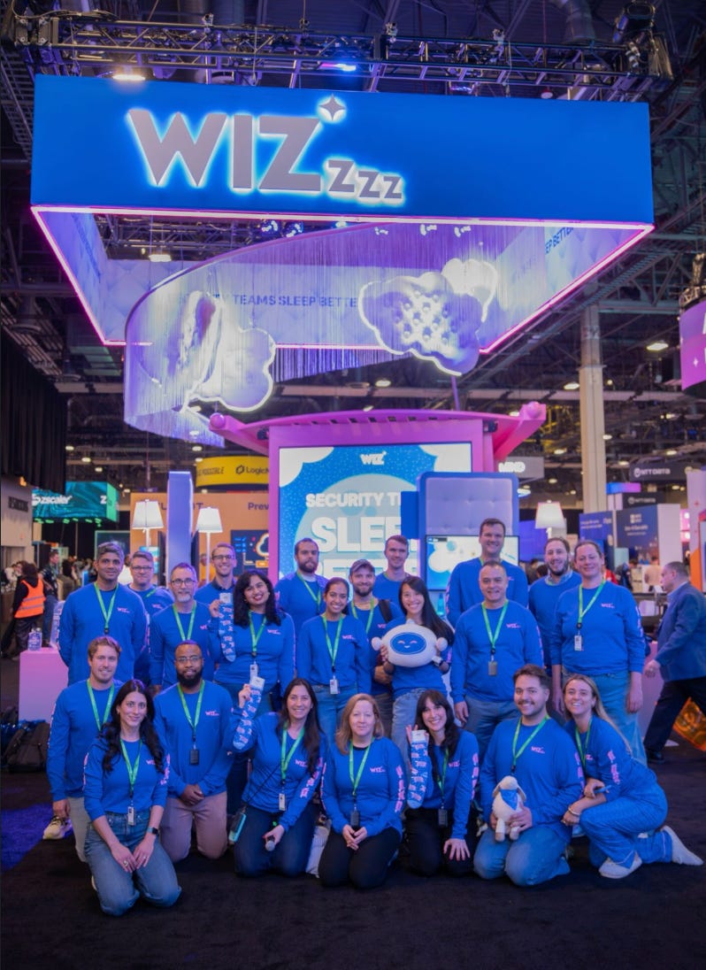 Wiz team in front of the WizZZZ booth at AWS re:Invent 2025.
