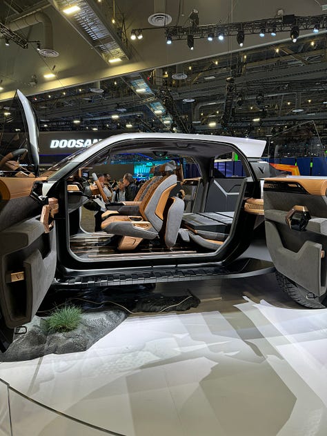 A gallery of photos including construction machinery, an electric truck, a plumbing van, a Polestar 3, and a yacht.