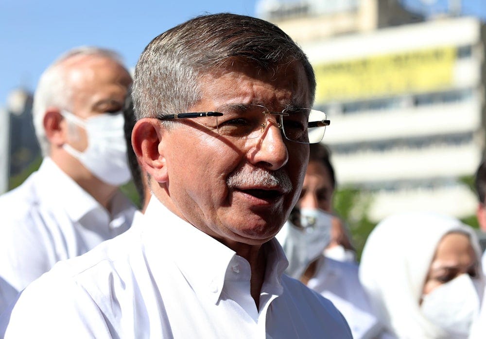 Former prime minister and opposition Future Party leader Ahmet Davutoglu speaks to the media outside the parliament May 26, 2021 (AP) Former prime minister and opposition Future Party leader Ahmet Davutoglu speaks to the media outside the parliament May 26, 2021 (AP)
