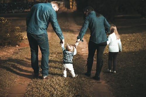 Free Family Walking on Path Stock Photo