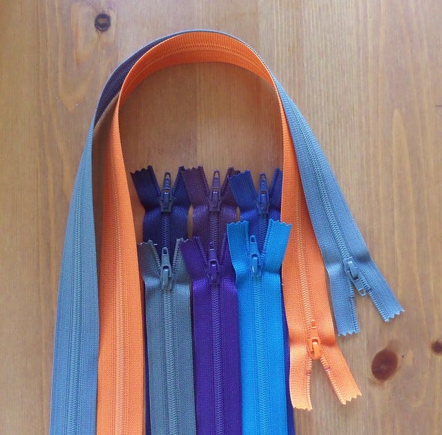 Orange and blue zips Orange and blue zips