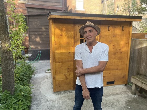 Frank in front of his Toronto home sauna