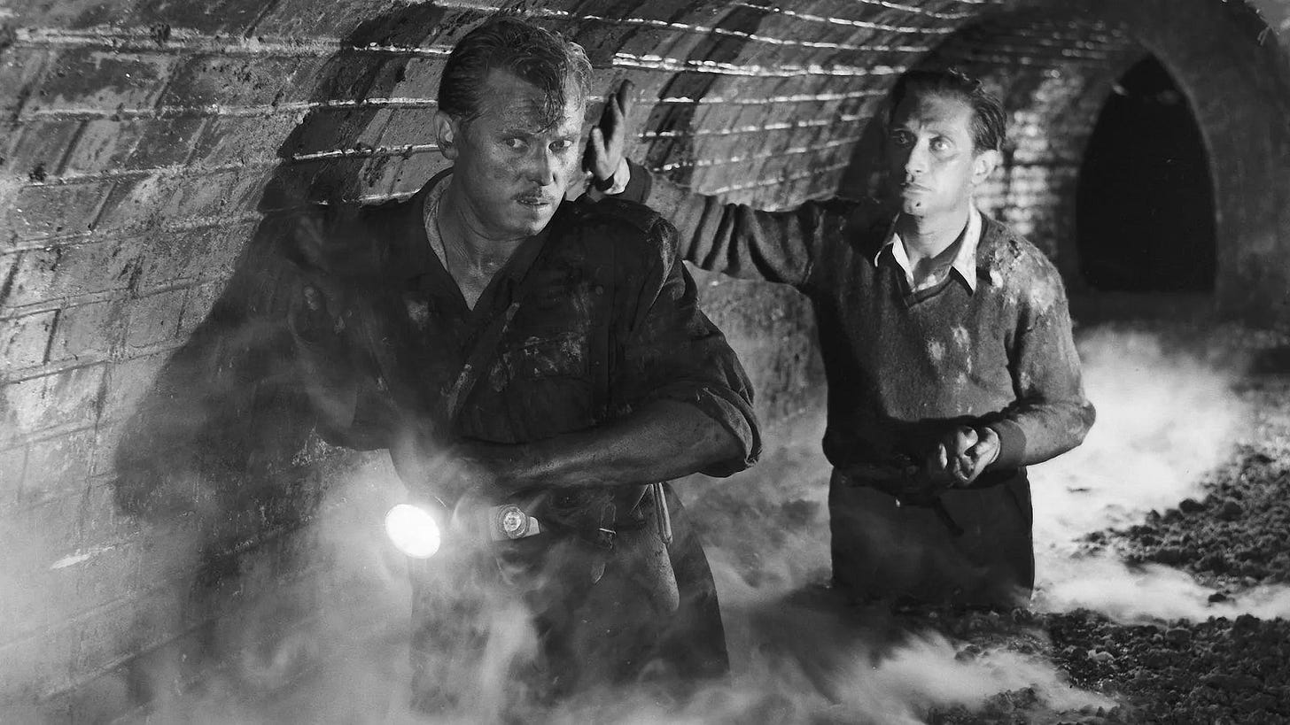 Mądry (Emil Karewicz) and Michał (Władysław Sheybal) negotiate the sewers.