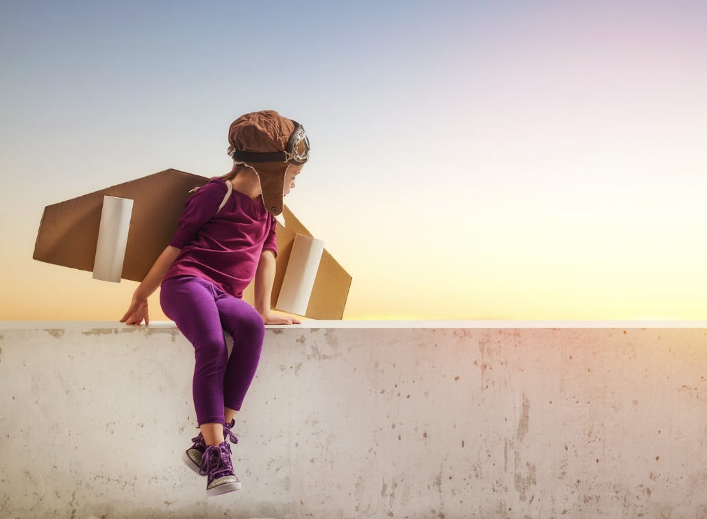 Kid with cardboard wings