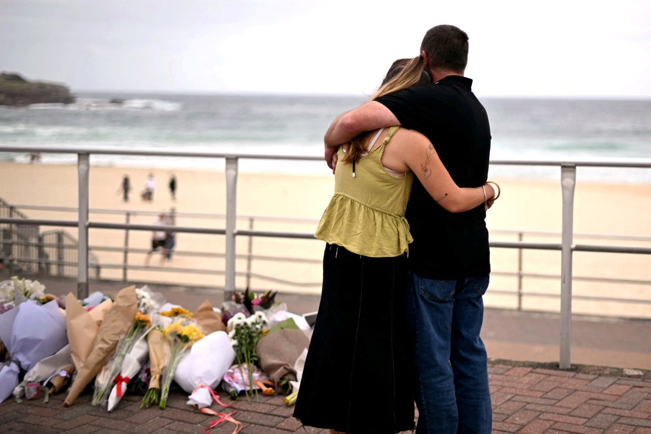 Mourners at Bondi Beach in Sydney on Dec. 16. Mourners at Bondi Beach in Sydney on Dec. 16.