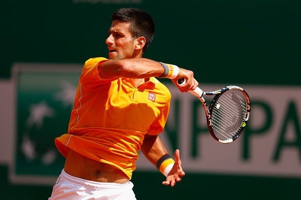 novak djokovic returns ball to andreas haider maurer for monte carlo masters win 2015 novak djokovic returns ball to andreas haider maurer for monte carlo masters win 2015