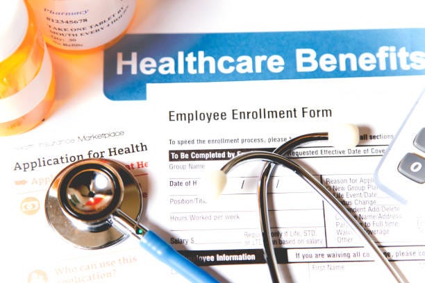 Open enrollment healthcare benefit forms. Healthcare benefit forms including: enrollment forms and applications, stethoscope, calculator.  Affordable healthcare remains an important topic around the world! health benefits stock pictures, royalty-free photos & images