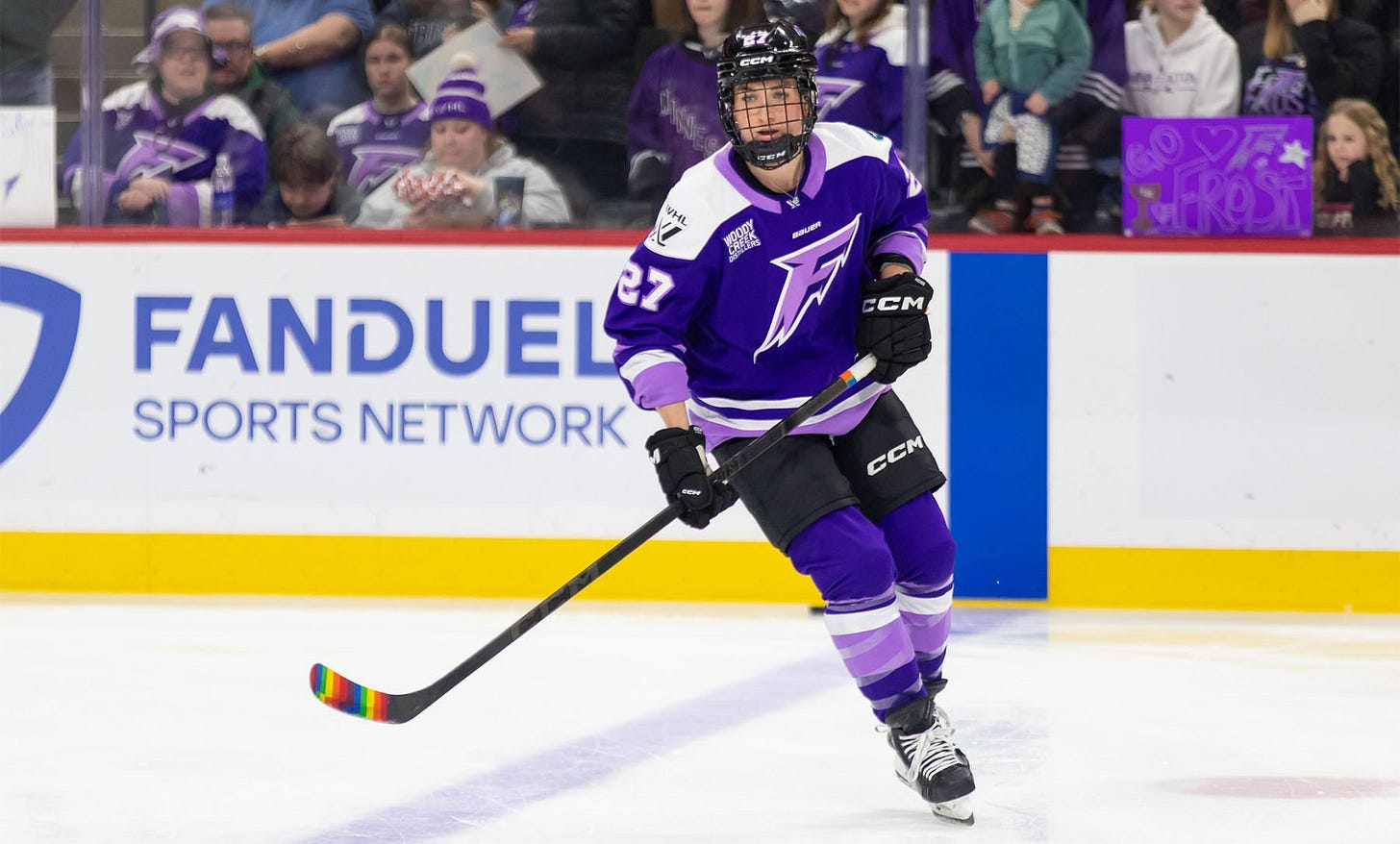 Taylor Heise with rainbow tape on her stick.