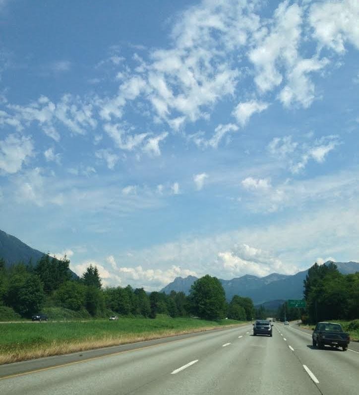 clouds over freeway in washington