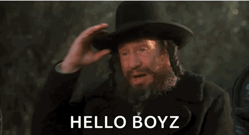 a man with a beard is wearing a top hat and saying hello boyz . a man with a beard is wearing a top hat and saying hello boyz .