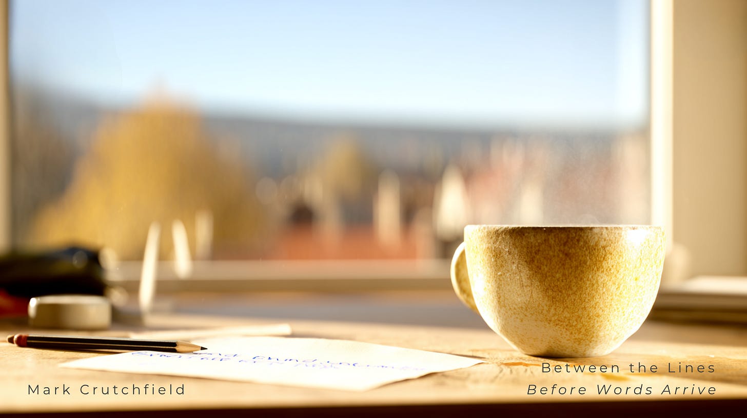 Golden morning light falls across a cup of coffee, a pencil, and a blank page by a window. Steam drifts gently as trees blur in the distance. The space feels calm and expectant — a pause before thought becomes language. Golden morning light falls across a cup of coffee, a pencil, and a blank page by a window. Steam drifts gently as trees blur in the distance. The space feels calm and expectant — a pause before thought becomes language.