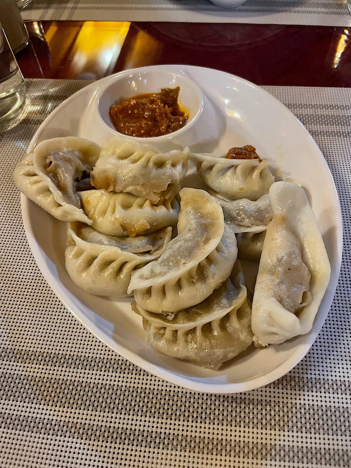 I had momos, a Nepali standby. These are made correctly, unlike the ones I made when our son’s mother-in-law tried to teach me how to shape them. That crescent shape is surprisingly difficult to form!