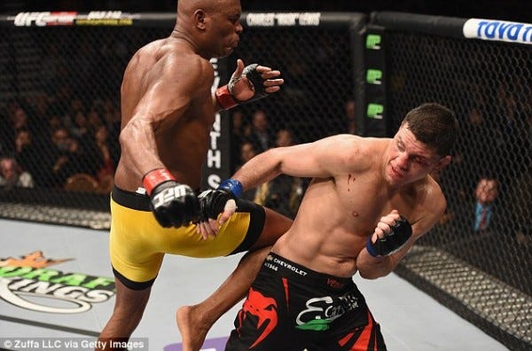 anderson silva putting knee to nick diaz back for ufc 183 2015 images anderson silva putting knee to nick diaz back for ufc 183 2015 images