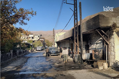 Beit Jinn in the immediate aftermath of the strike — homes torn open, streets covered in debris, and White Helmet rescuers searching for survivors beneath collapsed structures.