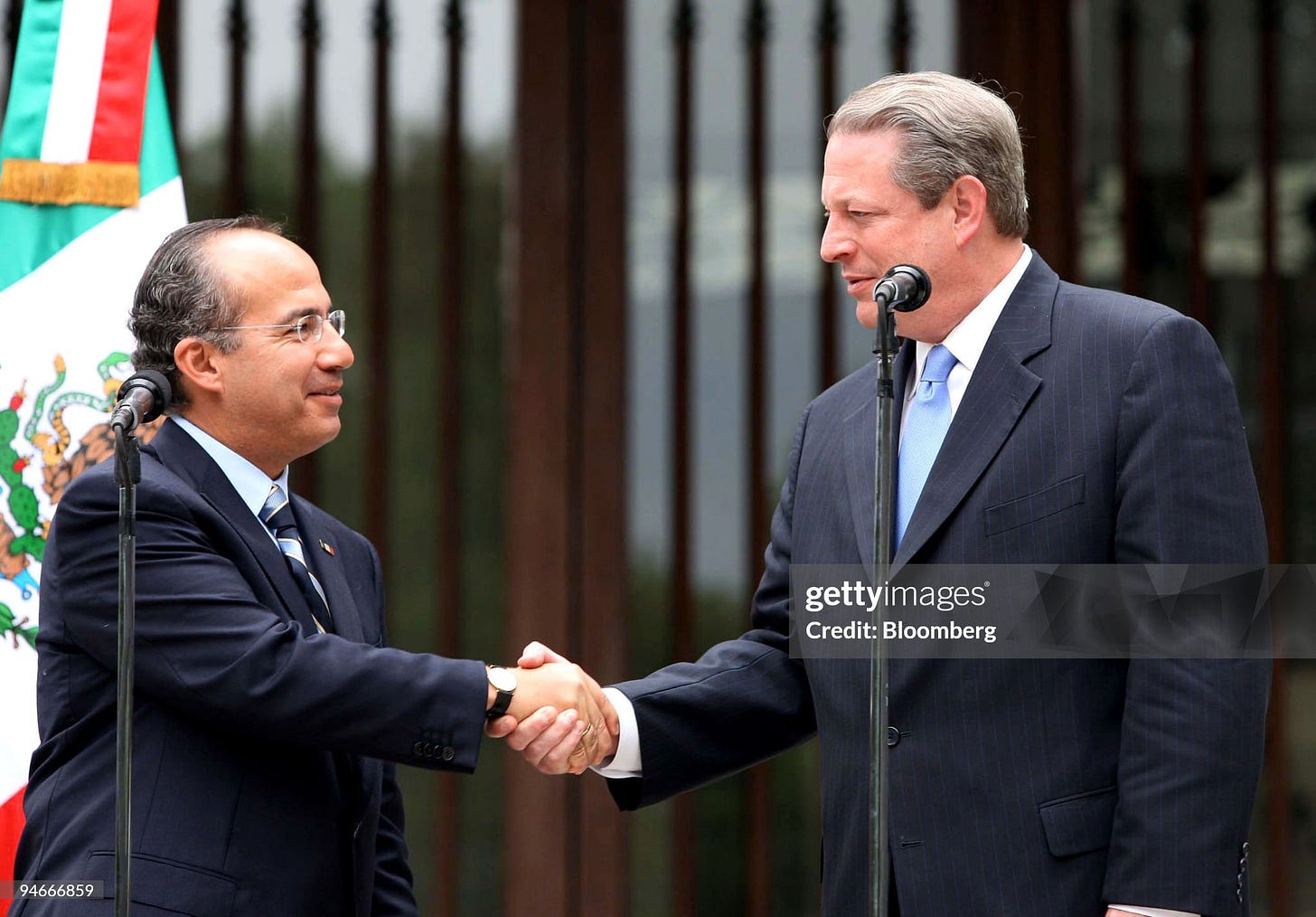 Mexican President Felipe Calderon, left, greets former U.S. Mexican President Felipe Calderon, left, greets former U.S.