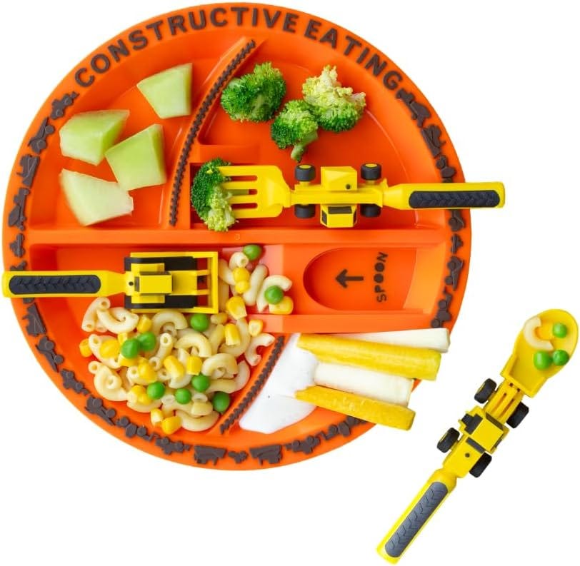 an orange plate with fruits, veggies and utensils shaped as construction equipment