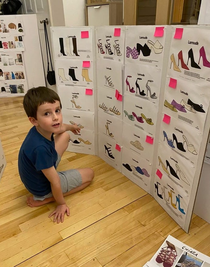 Larroude family looking at boards of product samples Larroude family looking at boards of product samples