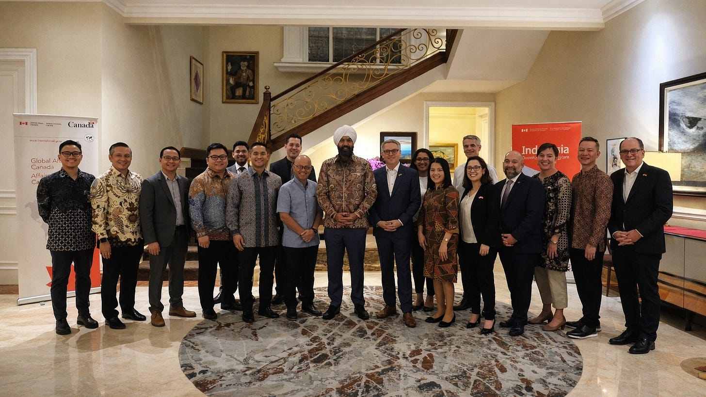 Several well-dressed people posed for photos in a room, with Canada’s Secretary of State for International Development, Randeep Sarai, as the central figure, after a trade meeting between Canada and Indonesia. Several well-dressed people posed for photos in a room, with Canada’s Secretary of State for International Development, Randeep Sarai, as the central figure, after a trade meeting between Canada and Indonesia.