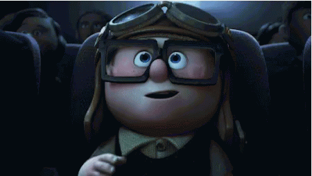 a cartoon character wearing goggles is sitting in a theater . a cartoon character wearing goggles is sitting in a theater .