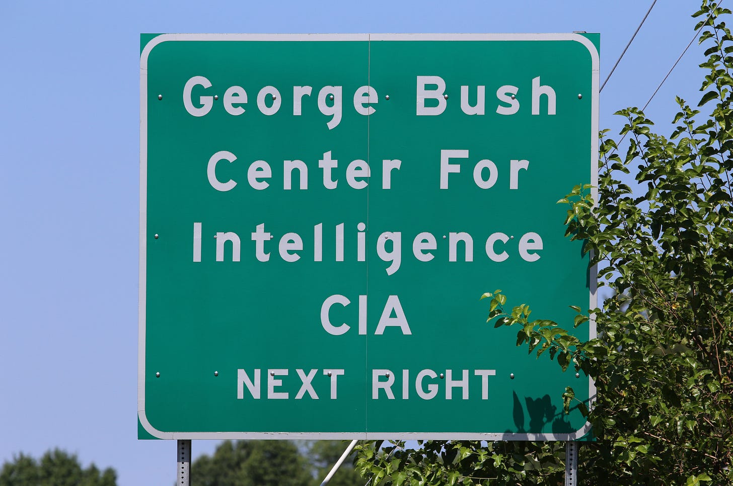 A road sign pointing the way to the CIA Headquarters complex in Langley, VA on July 19, 2017. The George Bush Center for Intelligence is the headquarters of the CIA. Credit: Katherine Welles / Shutterstock.com