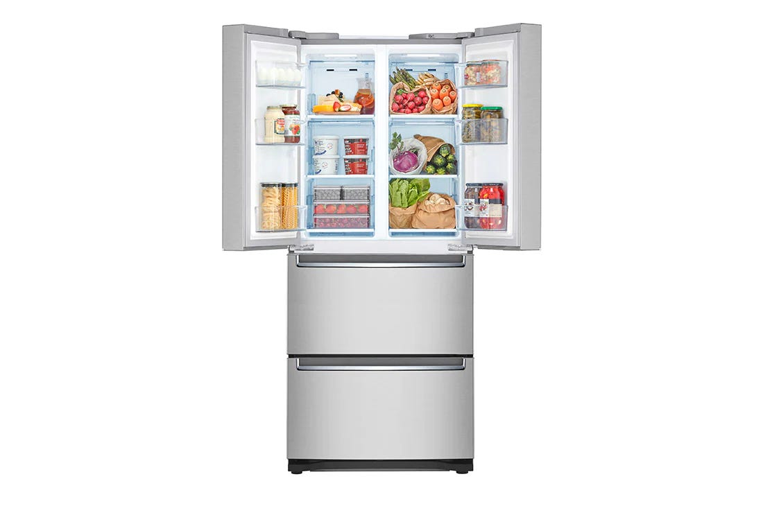 A very large fridge with open French doors showing the food inside. Two drawers below are closed.  A very large fridge with open French doors showing the food inside. Two drawers below are closed.