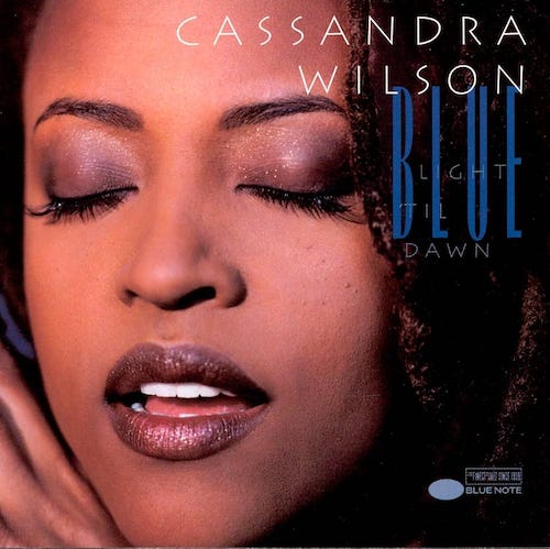 Cover of Cassandra Wilson Blue Light Til Dawn Album. Closeup of a Black woman's face with eyes closed and lips parted.