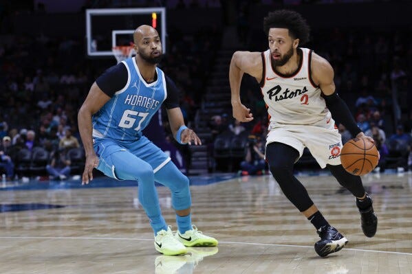 Pistons guard Cade Cunningham leaves loss to the Hornets with hip injury  after hard fall | AP News