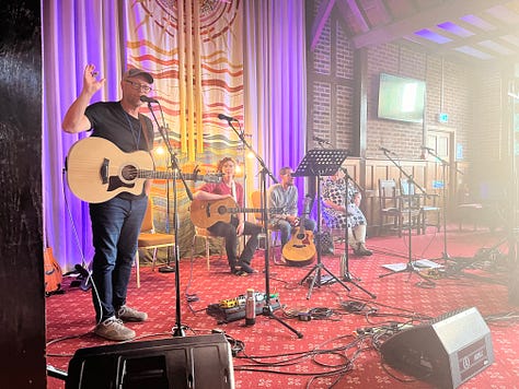 Andrew Peterson and other musicians playing - Esther Meek lecturing - the Northern Lights - Hayes Conference Centre in sunshine - printmaking workshop - selfie in front of Hutchmoot banner - Ruth Naomi Floyd singing - my copy of Every Moment Holy vol 3 with a print from it - Ted Turnau delivering the keynote