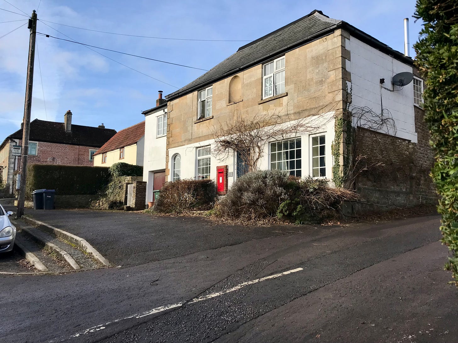 The old Post Office retains a Royal Mail Postbox in the High Street Chapmanslade. Now converted to a house.