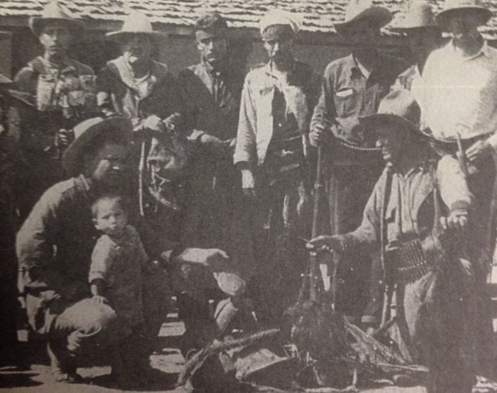 Grisly photo of Francisco Fimbres and others posing with the scalps of their enemies
