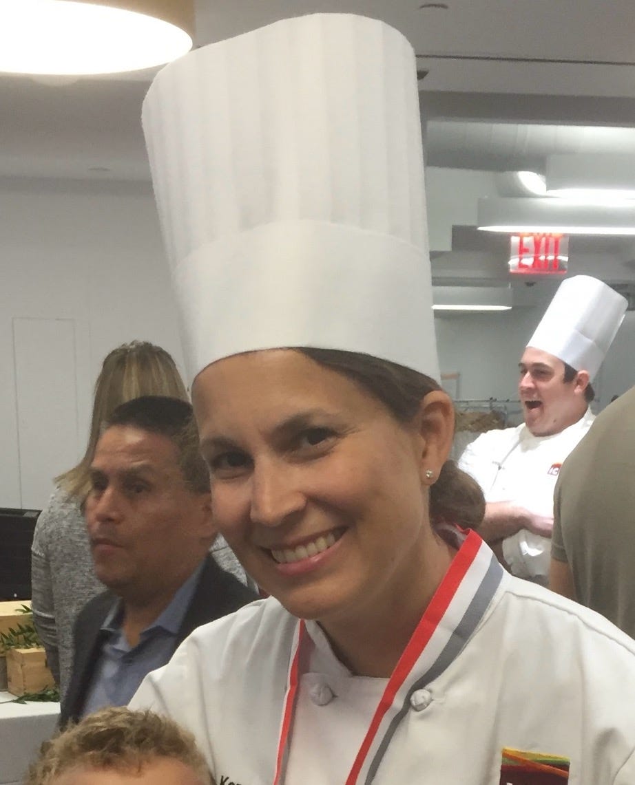 A person wearing a chef's hat

Description automatically generated