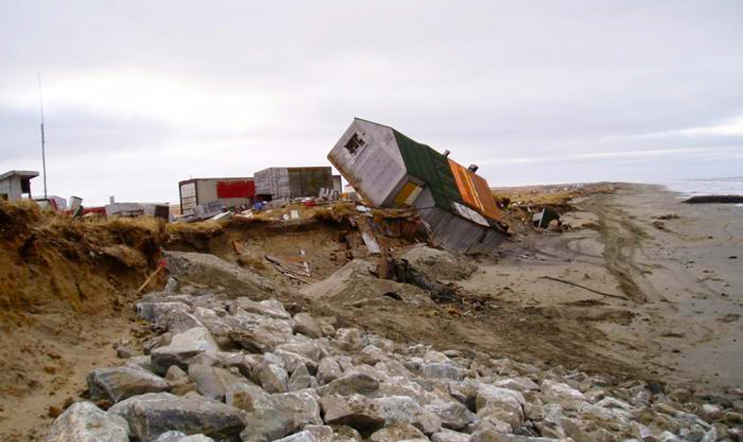 An Alaskan home off its foundation, perched at a 30 degree angle. An Alaskan home off its foundation, perched at a 30 degree angle.