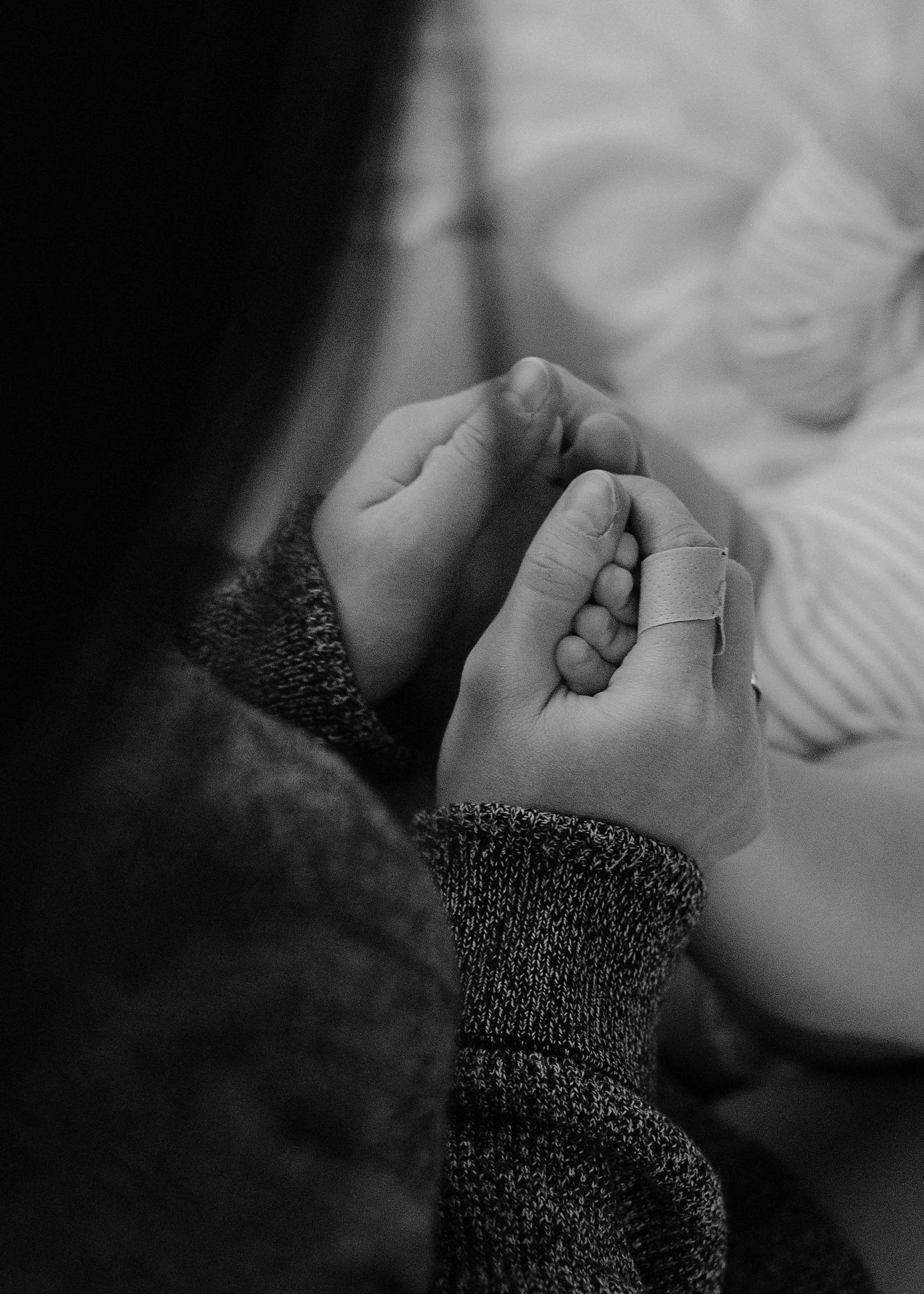 black and white image of mother and child holding hands black and white image of mother and child holding hands