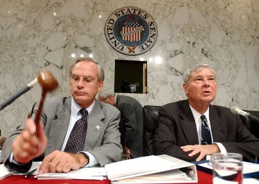 In a 2002 photo, Rep. Porter Goss, left, R-Fla., and Sen. Bob Graham, right, D-Fla., begin a hearing on intelligence failures leading up to the 9-11 attacks.