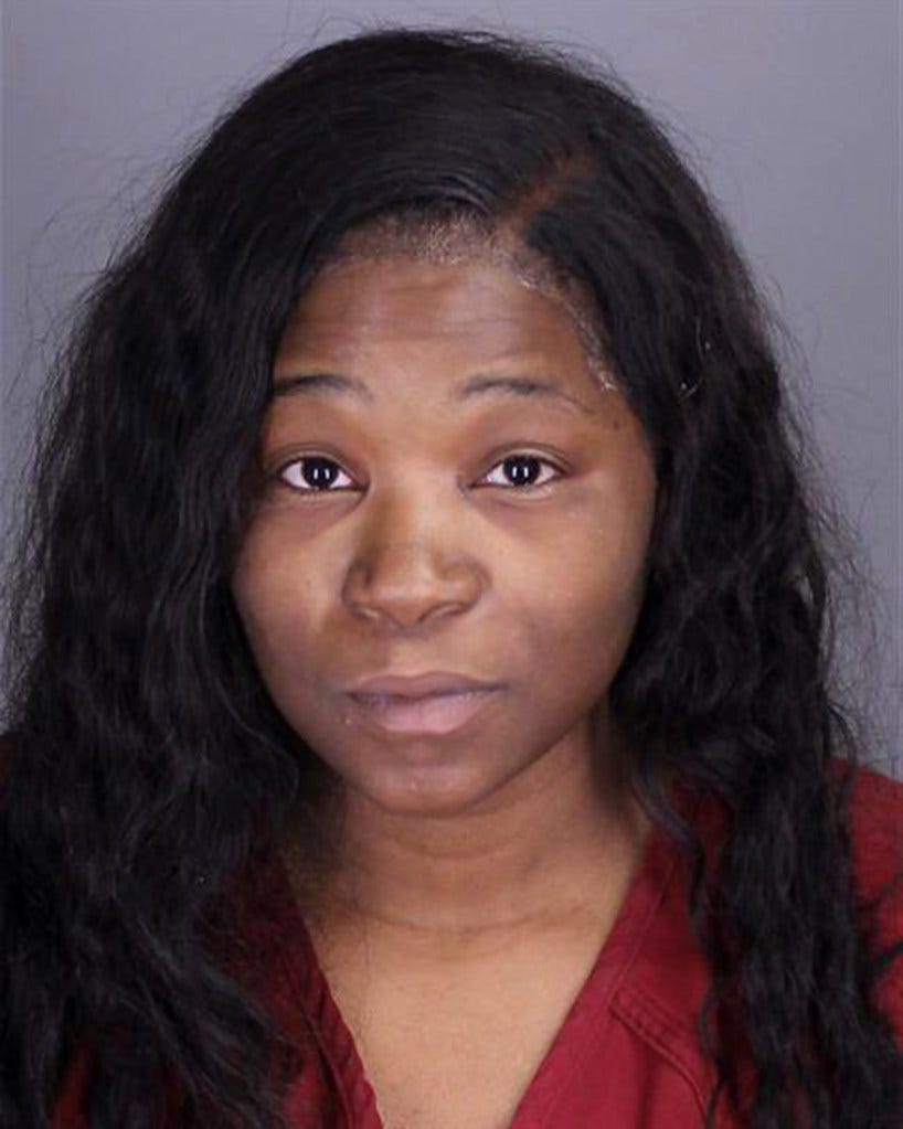 Woman with long black hair, identified as Kelli Marie Bryant, being charged by Oakland County prosecutor for child abuse and abandoning her children Woman with long black hair, identified as Kelli Marie Bryant, being charged by Oakland County prosecutor for child abuse and abandoning her children