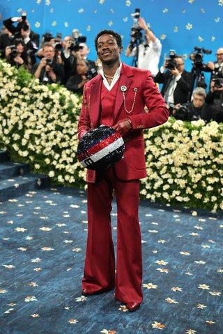 Image may contain Damson Idris Garibaldi Alves Filho Freddie Williams II Clothing Formal Wear Suit Adult and Person