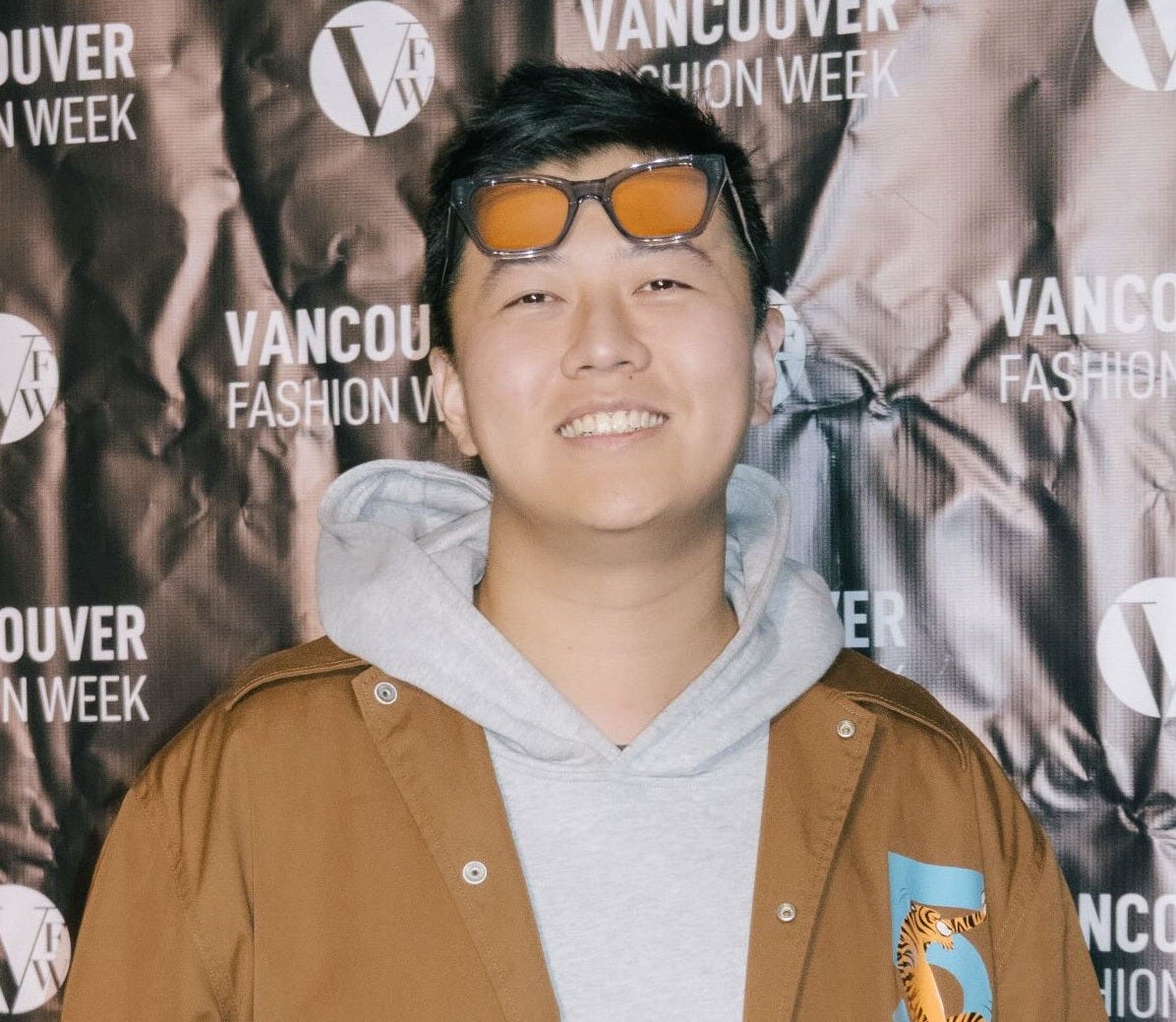 Photo by Hexiang Gu on October 19, 2025. May be an image of smiling, standing, flight jacket, parka and text that says 'UVER WEEK VANCOUVER HIONWEEK WEEK VANCOU FASHIONV VANCOUV FASHION WI OUVER WEEK / NCOUV HION WI JV COUV ONWEE ON WE WEE Zaijian'.