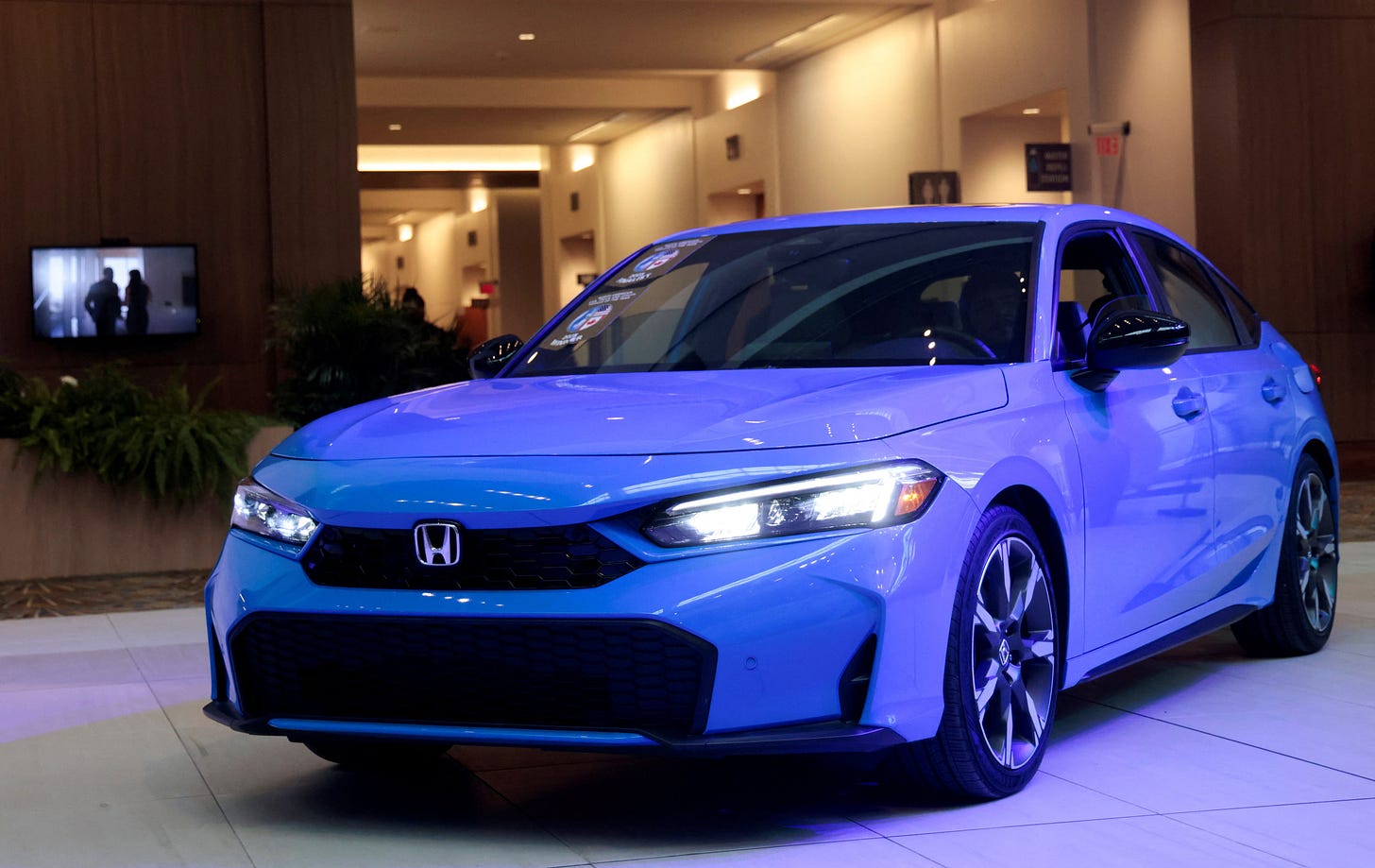 A Honda Civic Hybrid is seen on display after winning the 2025 North American Car of the year award