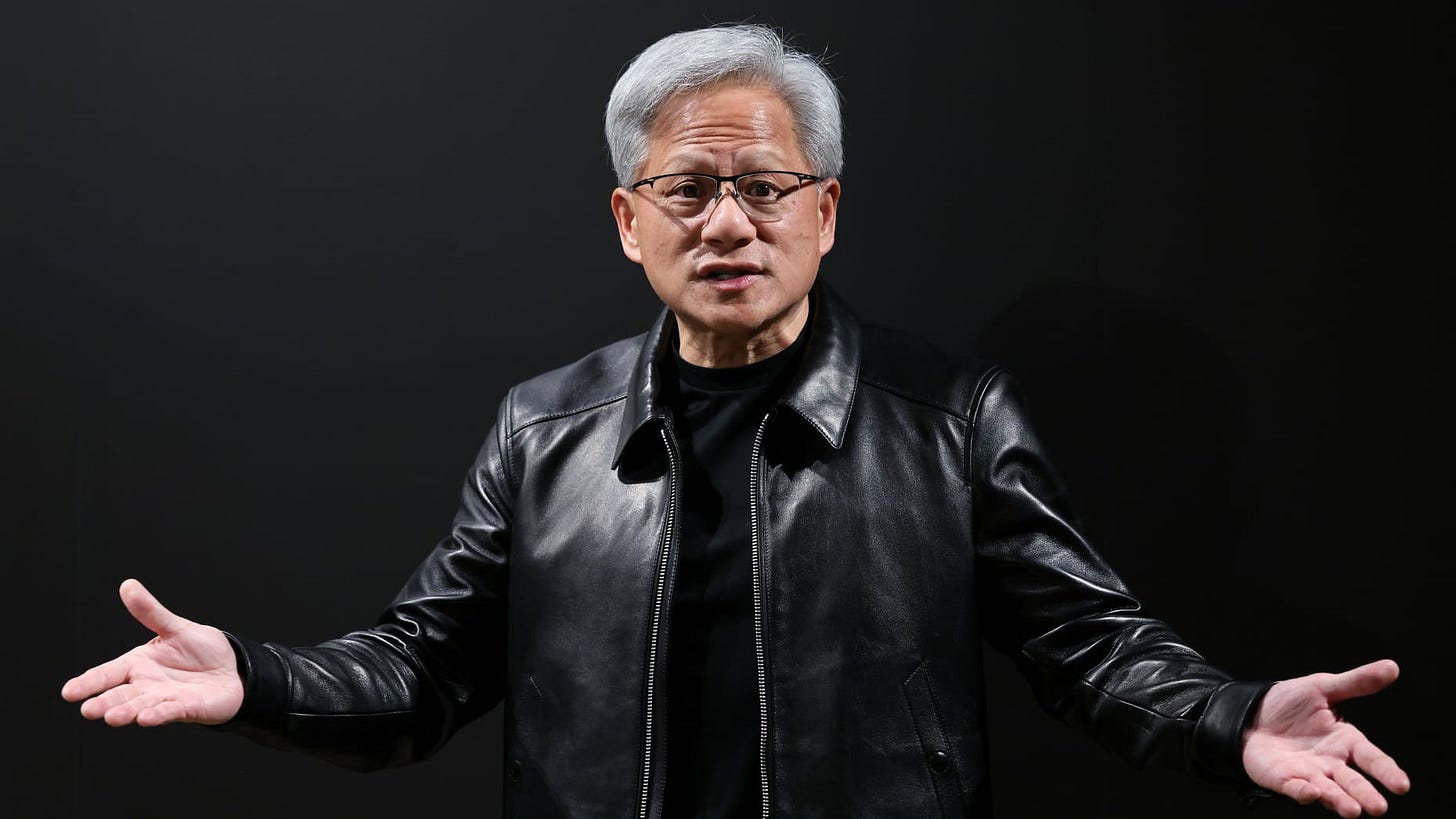 Jensen Huang, chief executive officer of Nvidia Corp., speaks to members of the media following the company's 