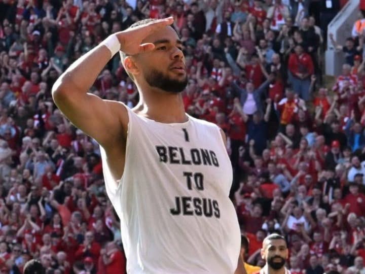 May be an image of basketball, American football, crowd and text that says "BELONG Τα JESUS"