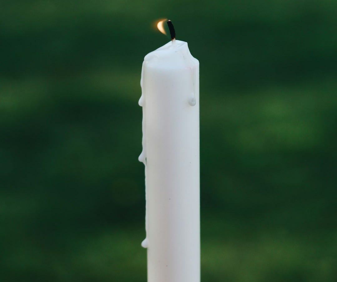 white candle in tilt shift lens white candle in tilt shift lens