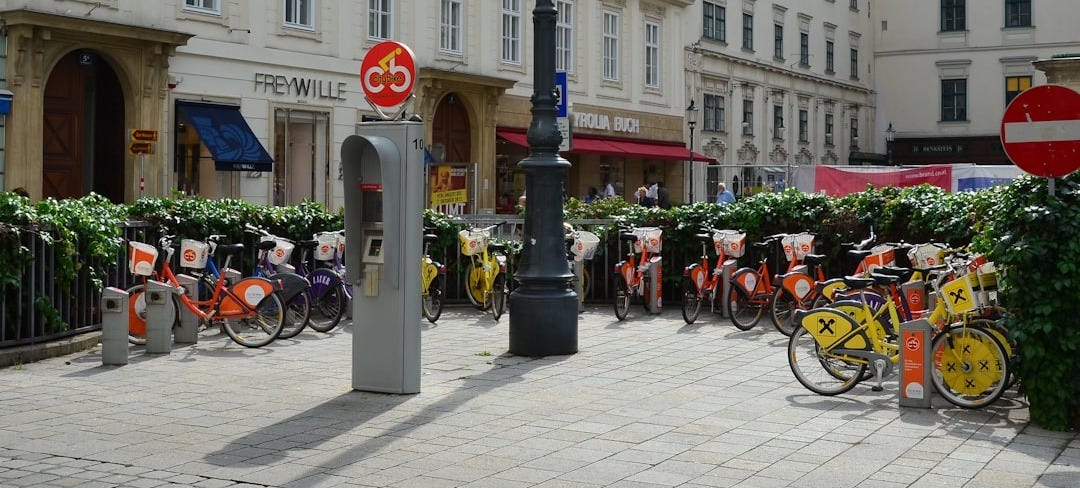 a group of bicycles parked next to each other on a street