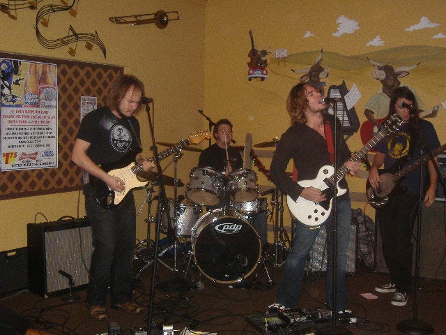 Lower Class Citizens rocking out. I thought the 'Keith Richards for President' shirt on the bass player was amusing too. Lower Class Citizens rocking out. I thought the 'Keith Richards for President' shirt on the bass player was amusing too.