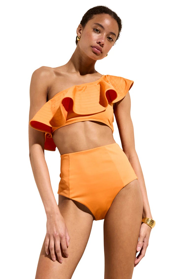 Swim suits with bold prints and one solid orange by Marie Oliver