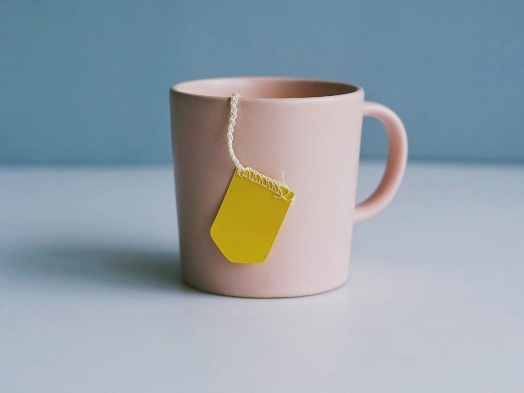 white ceramic mug on white surface white ceramic mug on white surface